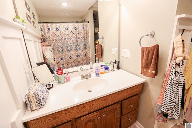 157 Calvert Dr, Paducah, KY 42003 - full bathroom featuring vanity, a textured ceiling, and a shower with shower curtain