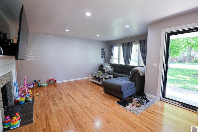 157 Calvert Dr, Paducah, KY 42003 - living room with a fireplace, healthy amount of natural light, hardwood / wood-style flooring, recessed lighting, and baseboards