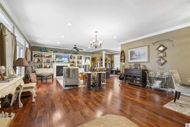 124 Hughes Rd, Benton, KY 42025 - living room with a glass covered fireplace, a chandelier, ornamental molding, ceiling fan, and wood finished floors