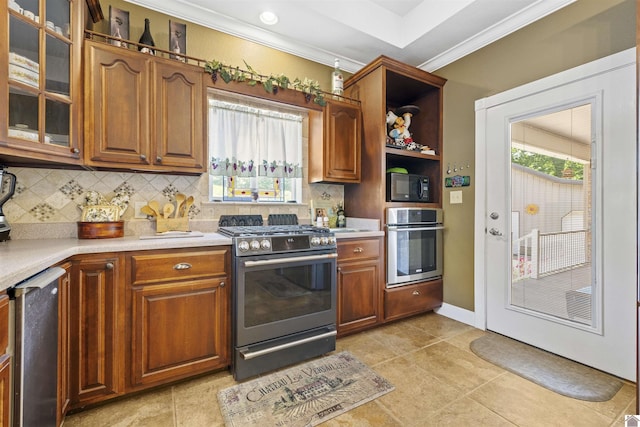 124 Hughes Rd, Benton, KY 42025 - kitchen featuring stainless steel appliances, decorative backsplash, light countertops, glass insert cabinets, and crown molding