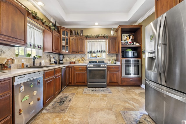 124 Hughes Rd, Benton, KY 42025 - kitchen with appliances with stainless steel finishes, healthy amount of natural light, a raised ceiling, decorative backsplash, and recessed lighting