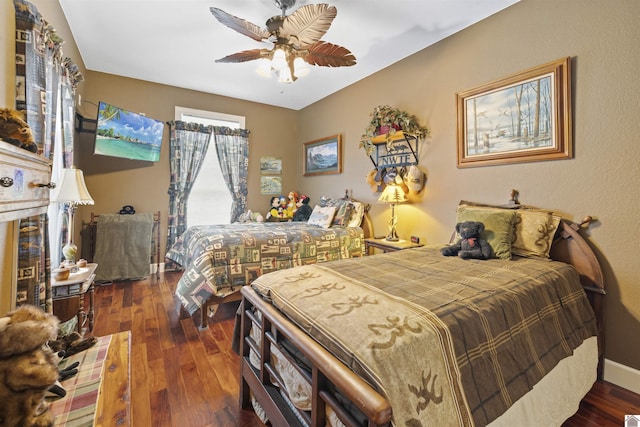 124 Hughes Rd, Benton, KY 42025 - bedroom with wood-type flooring, baseboards, and ceiling fan