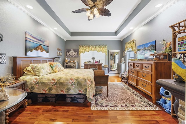 124 Hughes Rd, Benton, KY 42025 - bedroom with a tray ceiling, wood finished floors, ceiling fan, recessed lighting, and crown molding