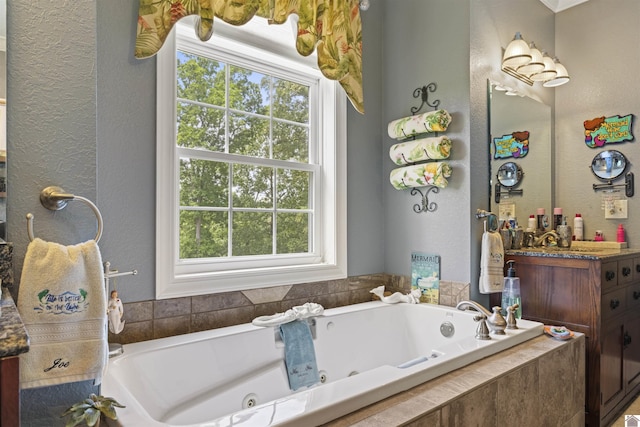 124 Hughes Rd, Benton, KY 42025 - full bath with vanity, a tub with jets, and a textured wall