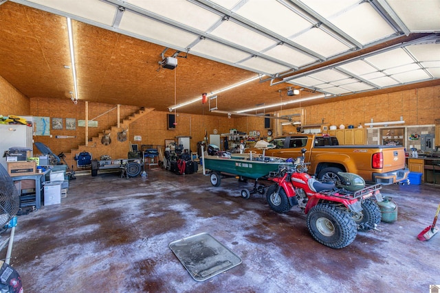 124 Hughes Rd, Benton, KY 42025 - garage with a workshop area and a garage door opener