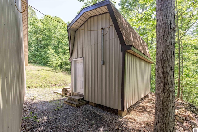 124 Hughes Rd, Benton, KY 42025 - view of outbuilding featuring a wooded view