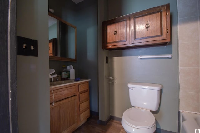 2310 S 28th, Paducah, KY 42003 - full bathroom featuring vanity, toilet, and wood finished floors