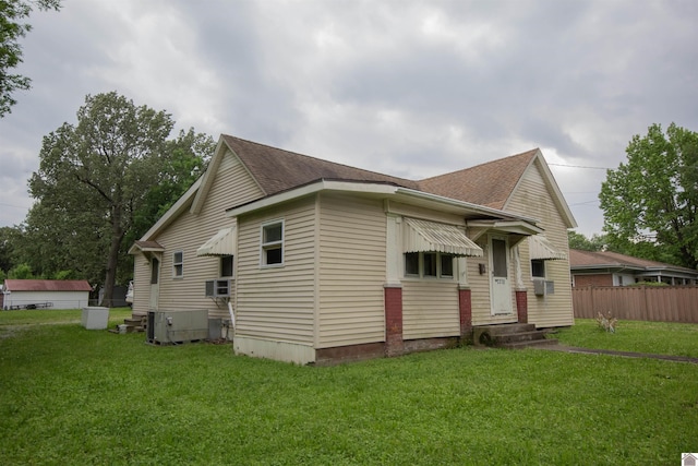 2310 S 28th, Paducah, KY 42003 - view of property exterior with entry steps, central air condition unit, and a shingled roof