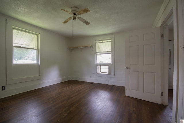 2310 S 28th, Paducah, KY 42003 - unfurnished room with a ceiling fan, dark wood-style floors, baseboards, and a textured ceiling