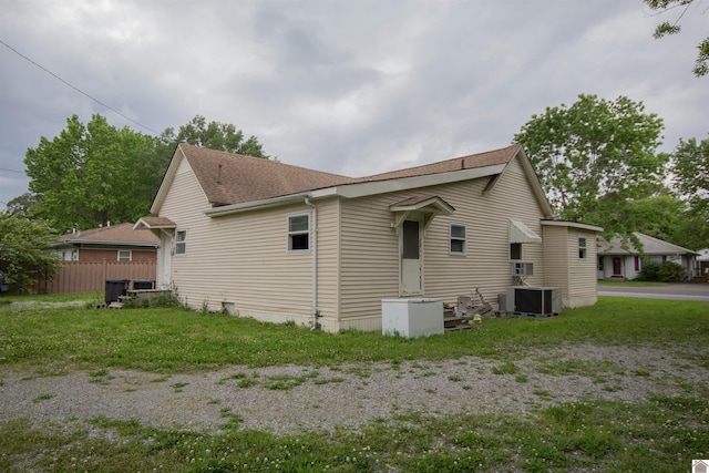 2310 S 28th, Paducah, KY 42003 - view of side of home with a shingled roof and central AC