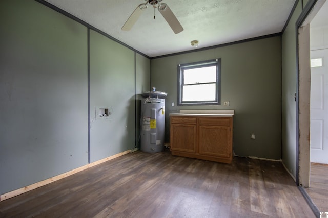 2310 S 28th, Paducah, KY 42003 - unfurnished room featuring electric water heater, crown molding, dark wood-style floors, a ceiling fan, and baseboards