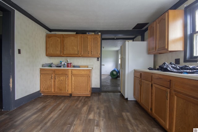 2310 S 28th, Paducah, KY 42003 - kitchen with dark wood-type flooring, light countertops, brown cabinets, baseboards, and freestanding refrigerator