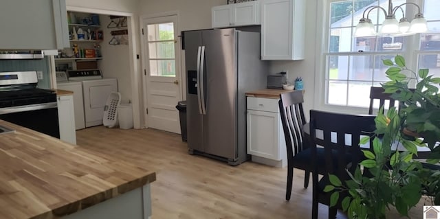 135 Phipps St, Paducah, KY 42001 - kitchen featuring wood counters, appliances with stainless steel finishes, washer and dryer, and healthy amount of natural light