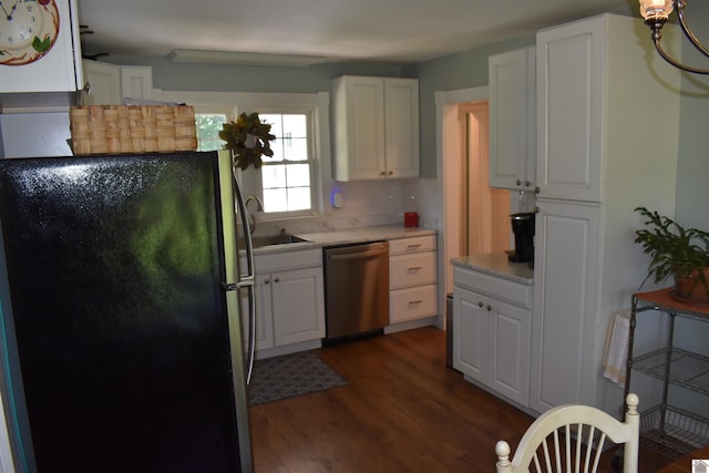 3975 Contest Rd, Paducah, KY 42001 - kitchen with appliances with stainless steel finishes, dark wood finished floors, white cabinetry, light countertops, and a sink
