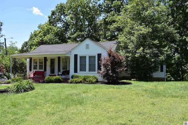 3975 Contest Rd, Paducah, KY 42001 - view of front of property featuring covered porch, a front yard, a chimney, and roof with shingles