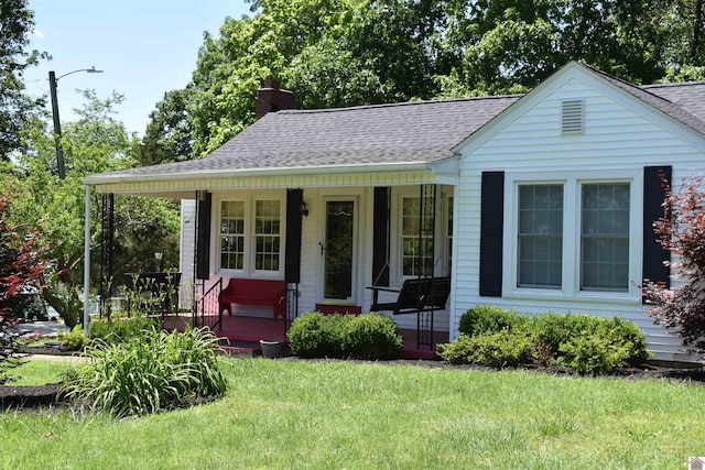 3975 Contest Rd, Paducah, KY 42001 - bungalow-style house with a porch, a front lawn, roof with shingles, and a chimney