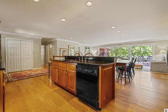 3011 Little Bear Hwy, Gilbertsville, KY 42044 - kitchen with dishwasher, a breakfast bar area, open floor plan, light wood-style flooring, and a sink