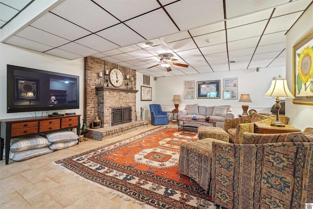 3011 Little Bear Hwy, Gilbertsville, KY 42044 - living room featuring a ceiling fan, a drop ceiling, and a fireplace