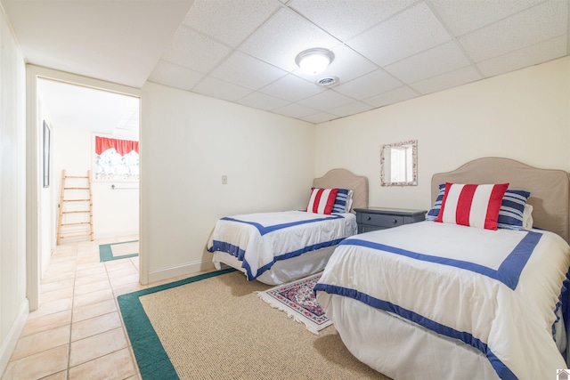 3011 Little Bear Hwy, Gilbertsville, KY 42044 - bedroom with a drop ceiling, light tile patterned floors, and baseboards