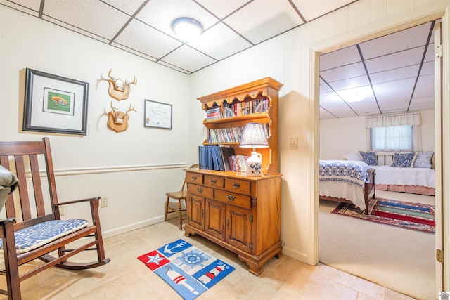 3011 Little Bear Hwy, Gilbertsville, KY 42044 - sitting room with a paneled ceiling, light tile patterned flooring, and wainscoting