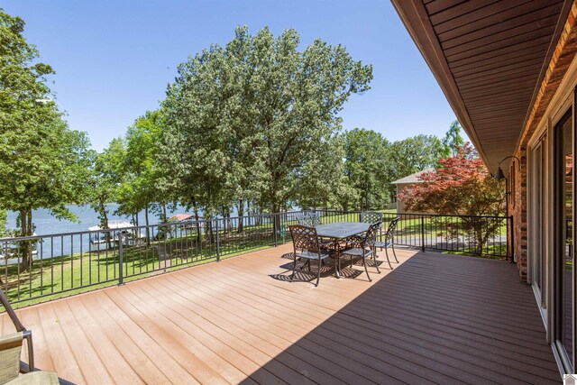 3011 Little Bear Hwy, Gilbertsville, KY 42044 - wooden terrace with outdoor dining space, a lawn, and a water view