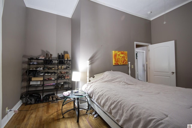 1641 Harrison, Paducah, KY 42001 - bedroom featuring ornamental molding, wood finished floors, and baseboards