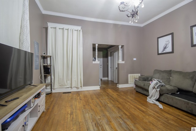 1641 Harrison, Paducah, KY 42001 - living room featuring hardwood / wood-style flooring, a chandelier, crown molding, and baseboards