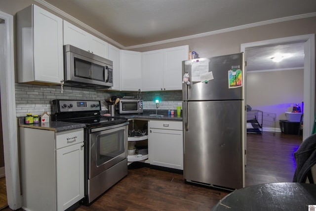 1641 Harrison, Paducah, KY 42001 - kitchen with stainless steel appliances, crown molding, backsplash, white cabinetry, and dark wood-style flooring