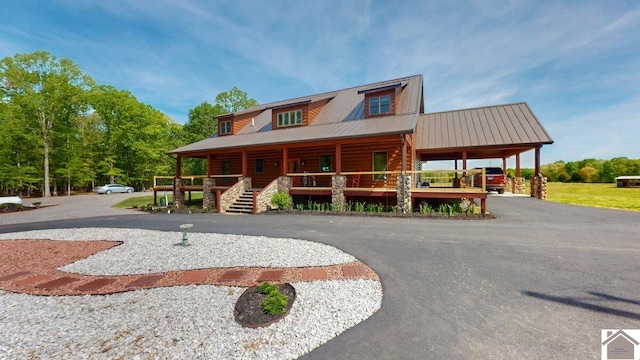 3210 Douglas Rd, Murray, KY 42071 - log cabin featuring covered porch and metal roof