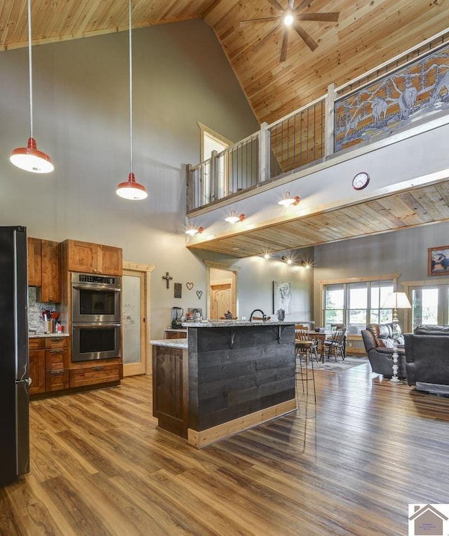 3210 Douglas Rd, Murray, KY 42071 - kitchen featuring high vaulted ceiling, stainless steel appliances, a ceiling fan, wood ceiling, and open floor plan