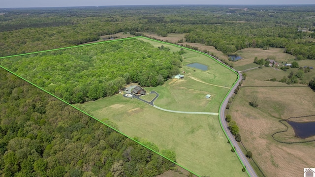 3210 Douglas Rd, Murray, KY 42071 - aerial overview of property's location with a heavily wooded area, property boundaries highlighted, and a large body of water