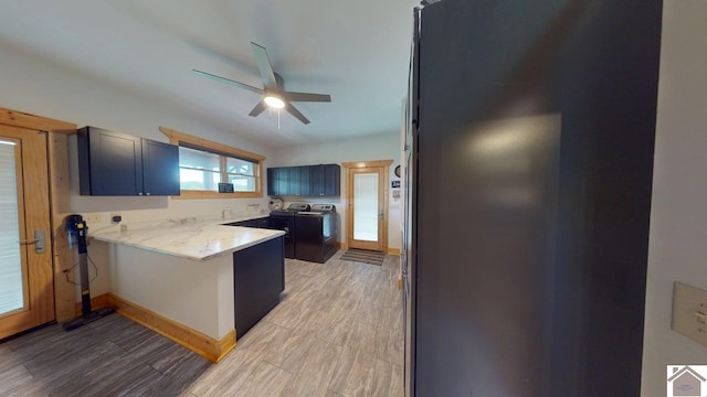 3210 Douglas Rd, Murray, KY 42071 - kitchen with a peninsula, ceiling fan, light wood-style flooring, and washer / dryer