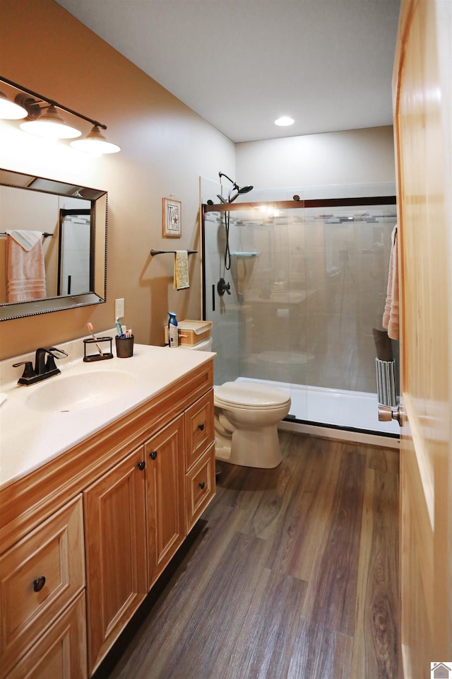 3210 Douglas Rd, Murray, KY 42071 - full bath with wood finished floors, vanity, a shower stall, and toilet