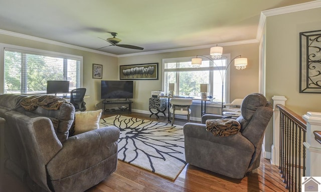 114 Shadyside Ln, Gilbertsville, KY 42044 - living area with wood finished floors, ceiling fan, plenty of natural light, ornamental molding, and baseboards
