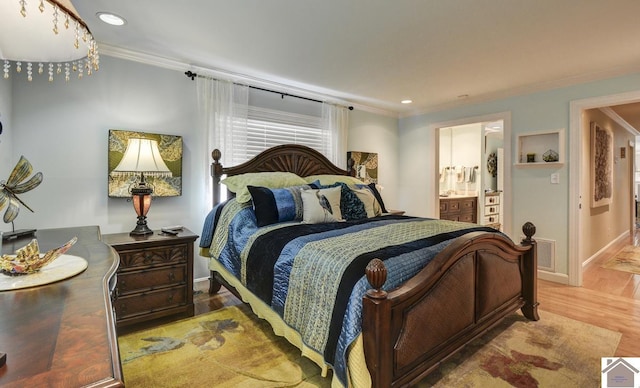 114 Shadyside Ln, Gilbertsville, KY 42044 - bedroom featuring ornamental molding, wood finished floors, ensuite bathroom, baseboards, and recessed lighting