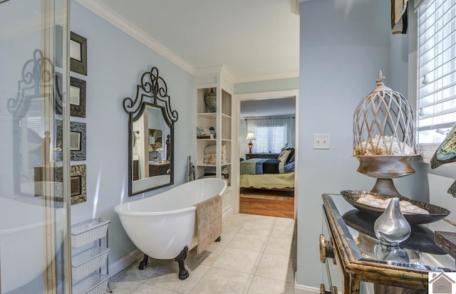 114 Shadyside Ln, Gilbertsville, KY 42044 - bathroom featuring a freestanding tub, ornamental molding, ensuite bath, tile patterned flooring, and baseboards