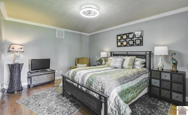114 Shadyside Ln, Gilbertsville, KY 42044 - bedroom with ornamental molding, wood finished floors, baseboards, and a textured ceiling