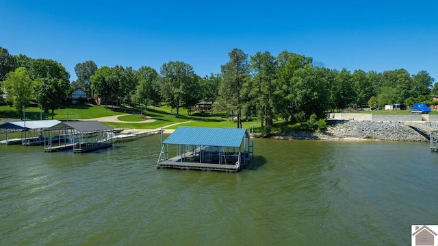 114 Shadyside Ln, Gilbertsville, KY 42044 - dock featuring boat lift, a water view, and a yard