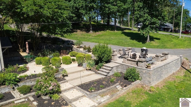 114 Shadyside Ln, Gilbertsville, KY 42044 - view of grassy yard with a fire pit and a garden