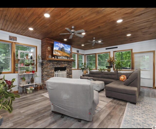 34 Navajo Ct, Cadiz, KY 42211 - living room featuring wooden ceiling, wood finished floors, a ceiling fan, a stone fireplace, and plenty of natural light