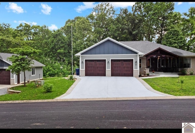 34 Navajo Ct, Cadiz, KY 42211 - single story home with driveway, a garage, board and batten siding, a front lawn, and brick siding