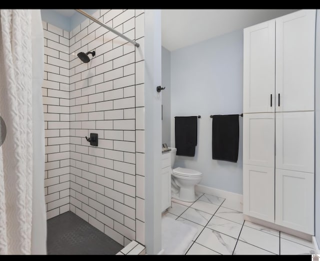 34 Navajo Ct, Cadiz, KY 42211 - bathroom with marble look tile flooring, a stall shower, toilet, and baseboards