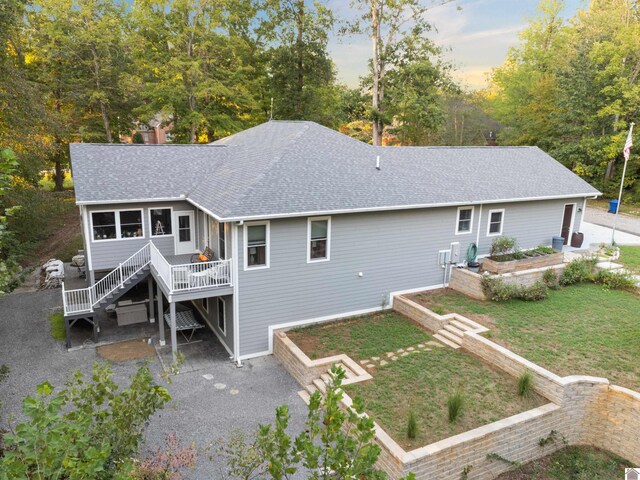 34 Navajo Ct, Cadiz, KY 42211 - back of house featuring a shingled roof, stairs, a yard, and a deck