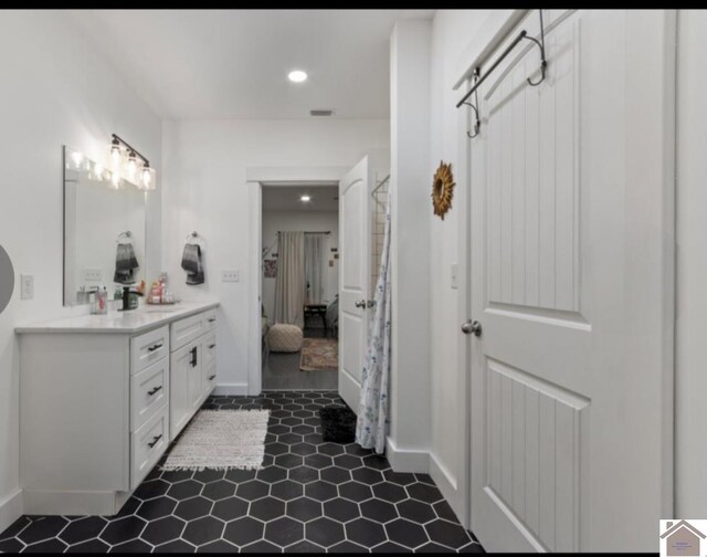 34 Navajo Ct, Cadiz, KY 42211 - ensuite bathroom with double vanity, recessed lighting, baseboards, and tile patterned flooring