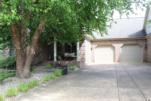 395 Wildcat Trce, Paducah, KY 42003 - view of front of property with brick siding, concrete driveway, and a shingled roof