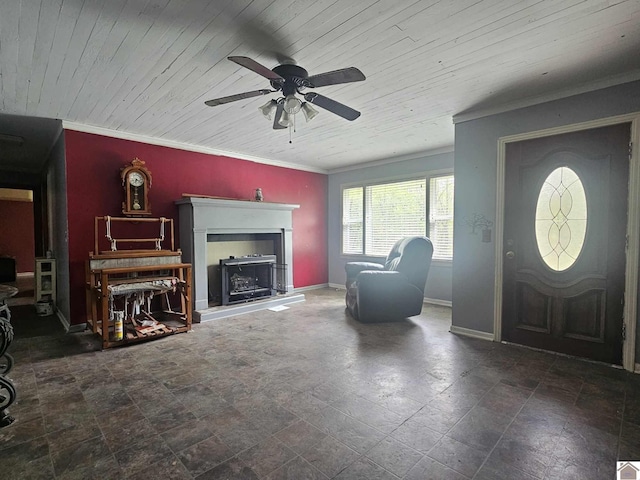 6694 State Line Rd E, Hazel, KY 42049 - entryway with crown molding, ceiling fan, baseboards, stone finish floors, and a fireplace with raised hearth