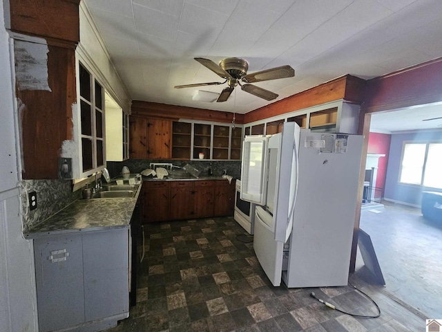 6694 State Line Rd E, Hazel, KY 42049 - kitchen with a sink, freestanding refrigerator, open shelves, backsplash, and ceiling fan