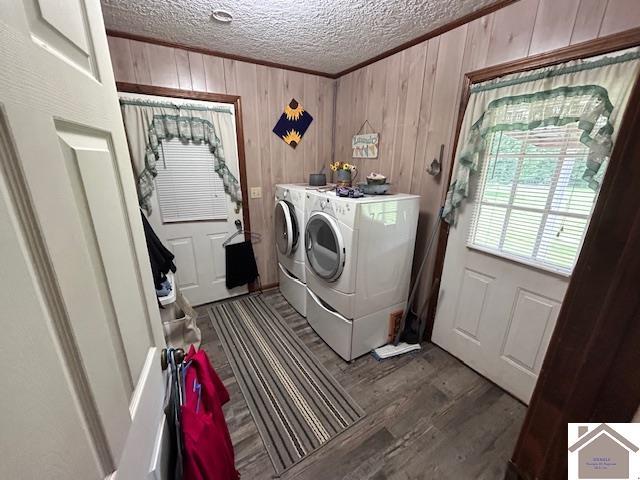 5812 State Route 123, Arlington, KY 42021 - washroom featuring washing machine and dryer, a textured ceiling, wooden walls, wood finished floors, and ornamental molding