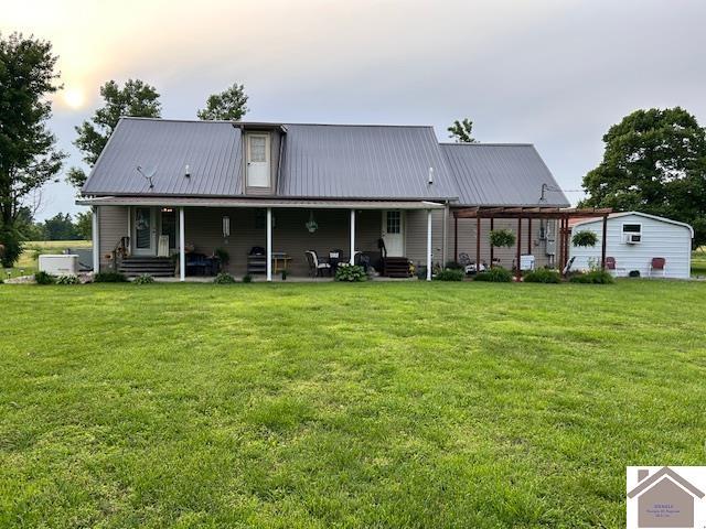 5812 State Route 123, Arlington, KY 42021 - back of property featuring a lawn, metal roof, and covered porch