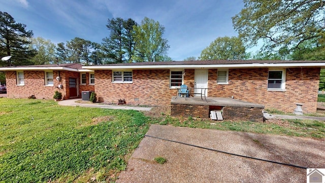 199 Park St, Gilbertsville, KY 42044 - ranch-style house featuring brick siding, a front lawn, central air condition unit, and crawl space
